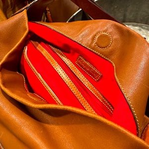 This beautiful leather, Dooney and Bourke hobo bag is all that and more